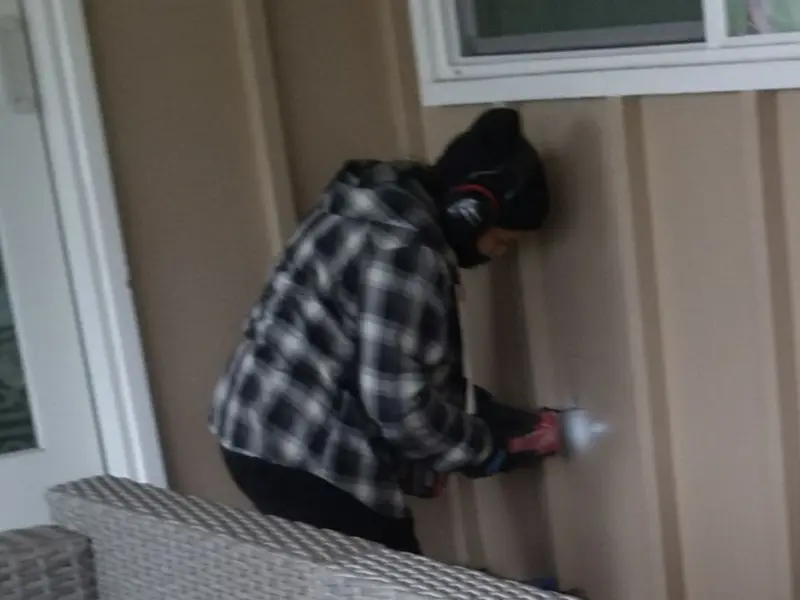 Professional electrician installing an exterior outlet in Silver Lake